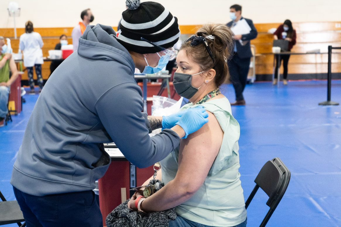 Healthcare workers administer vaccines at Emmanuel Baptist Church in East San Jose