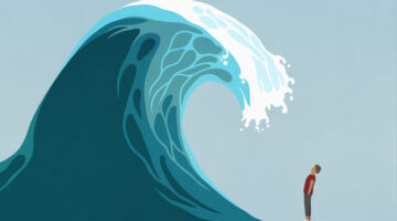 Man facing huge ocean tidal wave