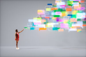 Digital generated image of young woman wiht dark skin standing on grey ramp surrounded with multicoloured message chat icons trying to interact with them.
