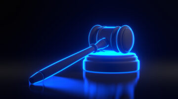 Judge gavelwith bright glowing futuristic blue neon lights on black background. Bidding at auctions. Liability for corruption. Protection of rights. Law and fine. Tax avoidance. 3D render illustration
