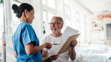 Nurse providing care and advice to a patient in a hospital setting