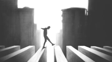 illustration of man crossing surreal road, risk concept black and white risk