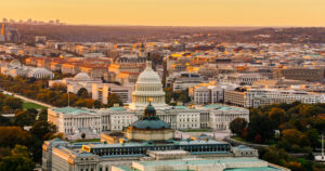 Helicopter shot of Capitol Hill in Washington, D.C. at sunset on a fall evening.