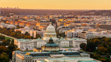 Helicopter shot of Capitol Hill in Washington, D.C. at sunset on a fall evening.