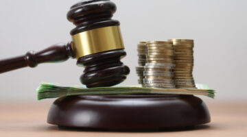 Gavel on Euro Background – Corruption, Fraud, Auctions, Fines, and Crime