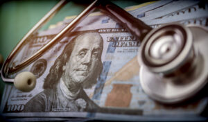 phonendoscope on American tickets, concept of sanitary copayment