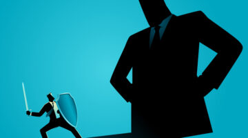 Businessman overshadowed by the shadow of a giant, representing business competition, unequal market power, corporate dominance, and the struggle of small businesses against larger competitors.