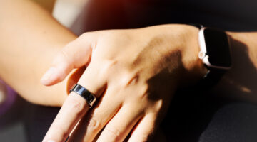 Woman wearing smart ring on her hand. Concept sport and healthy lifestyle